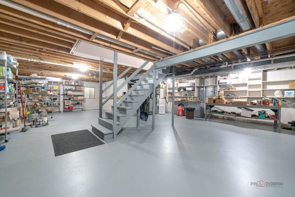 unfinished below grade area featuring stairway