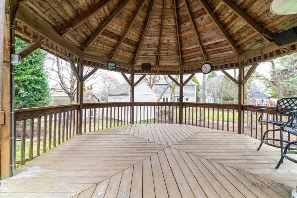 wooden deck featuring a gazebo