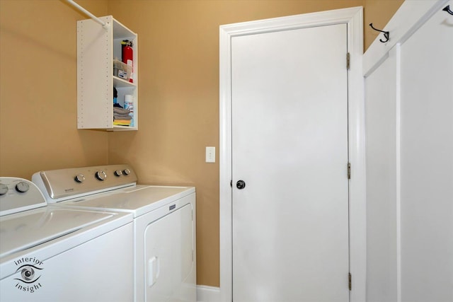 clothes washing area with laundry area and independent washer and dryer