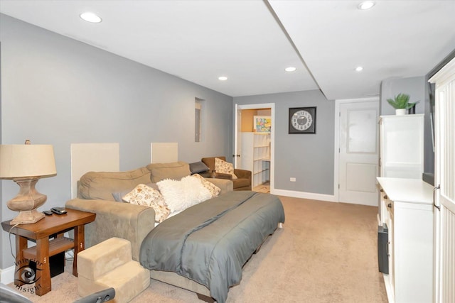 bedroom with light colored carpet, baseboards, and recessed lighting