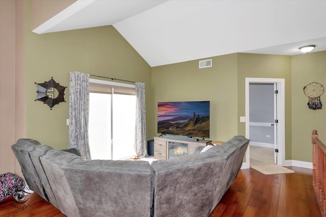 living area featuring visible vents, dark wood-style flooring, baseboards, and high vaulted ceiling