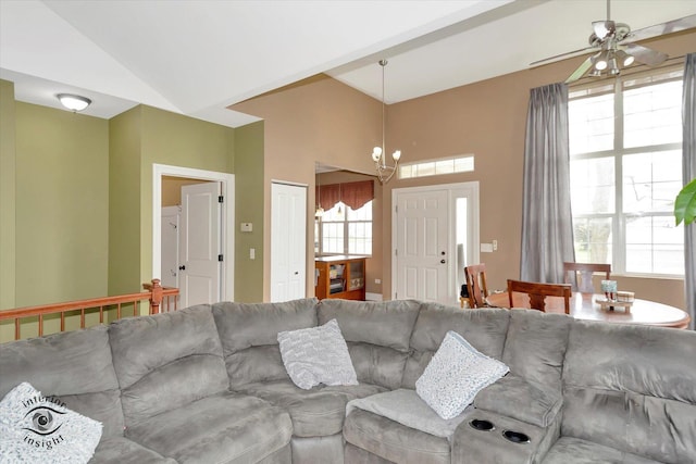 living area featuring ceiling fan and high vaulted ceiling