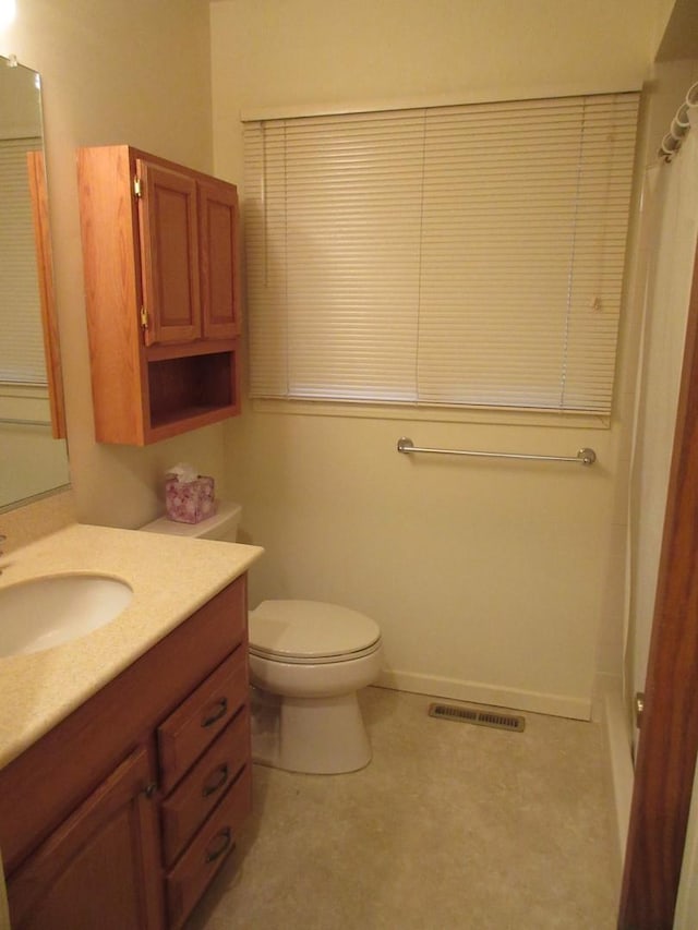 24541 S Wildwood Trl, Crete, IL 60417 - bathroom with toilet, vanity, curtained shower, and visible vents