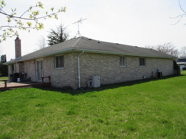 24541 S Wildwood Trl, Crete, IL 60417 - view of side of property with a yard, central AC unit, brick siding, and a deck