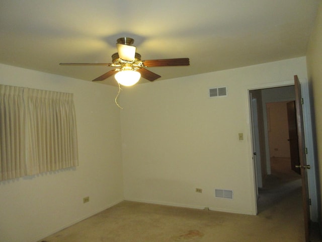 24541 S Wildwood Trl, Crete, IL 60417 - empty room featuring light carpet, baseboards, visible vents, and ceiling fan