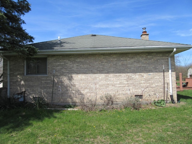 24541 S Wildwood Trl, Crete, IL 60417 - view of side of property with brick siding, a lawn, a chimney, and roof with shingles