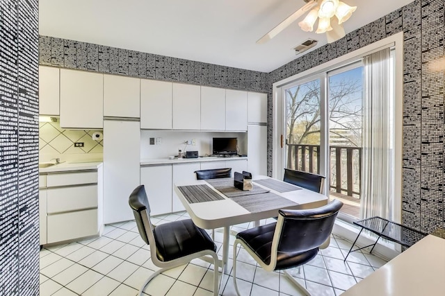dining room featuring a ceiling fan and light tile patterned floors