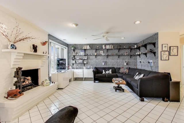 living room with a ceiling fan, a brick fireplace, recessed lighting, and light tile patterned floors