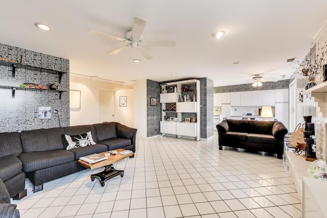 living room featuring light tile patterned flooring, ceiling fan, and recessed lighting
