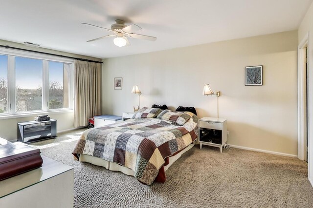 bedroom featuring a ceiling fan, baseboards, and carpet floors