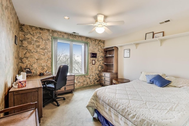 bedroom featuring light colored carpet, a ceiling fan, and visible vents