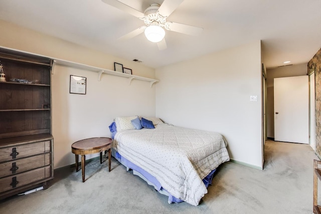 bedroom with carpet floors, visible vents, and ceiling fan