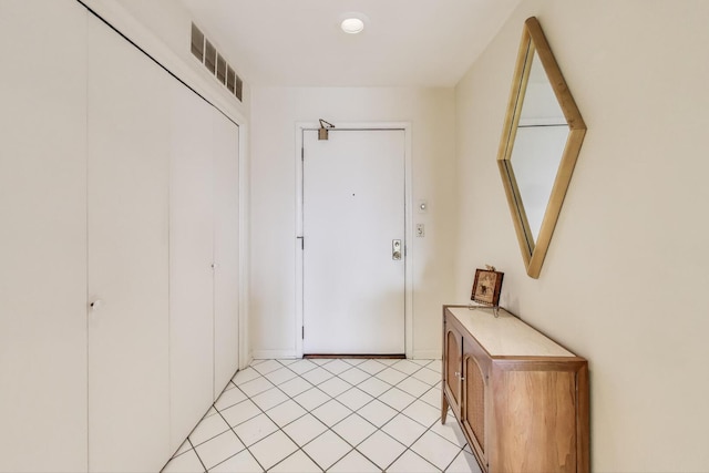 entryway with visible vents and light tile patterned floors