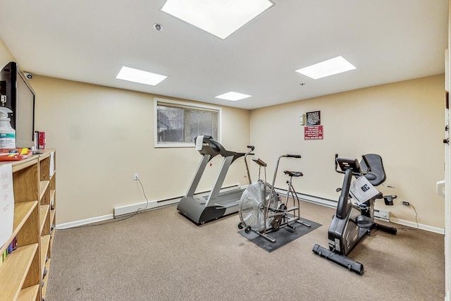 exercise area featuring carpet floors and baseboards