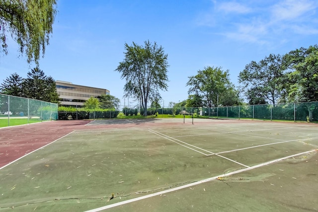 view of sport court featuring fence