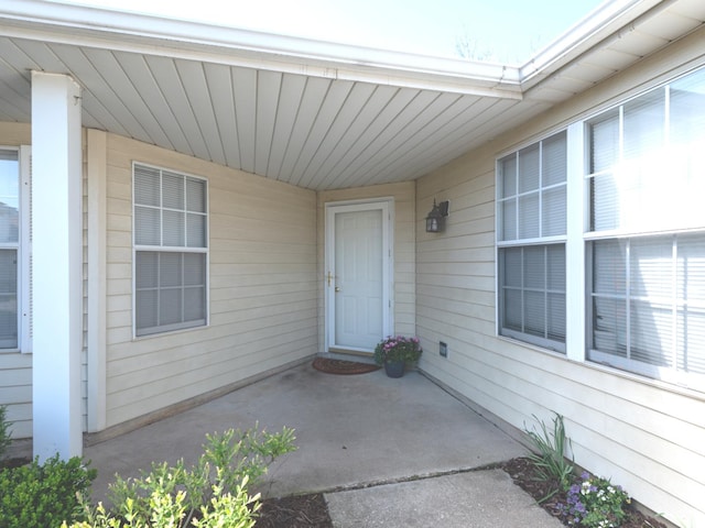entrance to property with a patio area