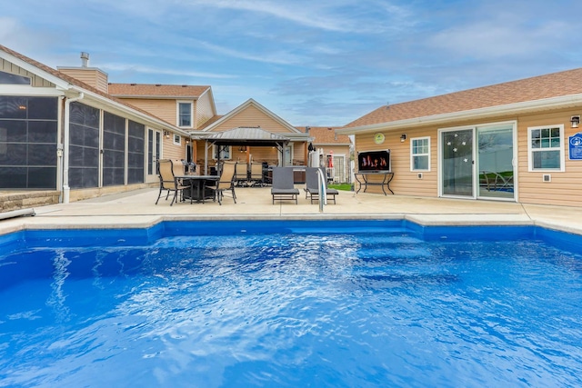 554 Fairway Dr, El Paso, IL 61738 - outdoor pool featuring a patio, a gazebo, outdoor dining area, and a sunroom