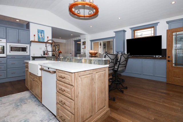 554 Fairway Dr, El Paso, IL 61738 - dining room with vaulted ceiling, dark wood-style floors, and a notable chandelier