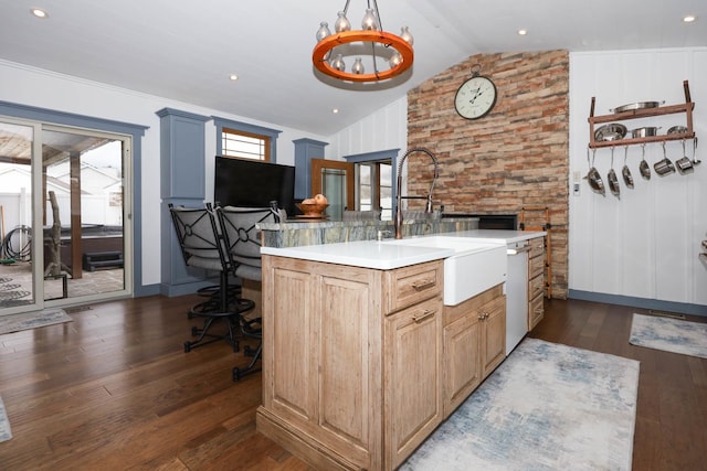 554 Fairway Dr, El Paso, IL 61738 - kitchen featuring a sink, light countertops, dark wood-style flooring, dishwashing machine, and a center island with sink