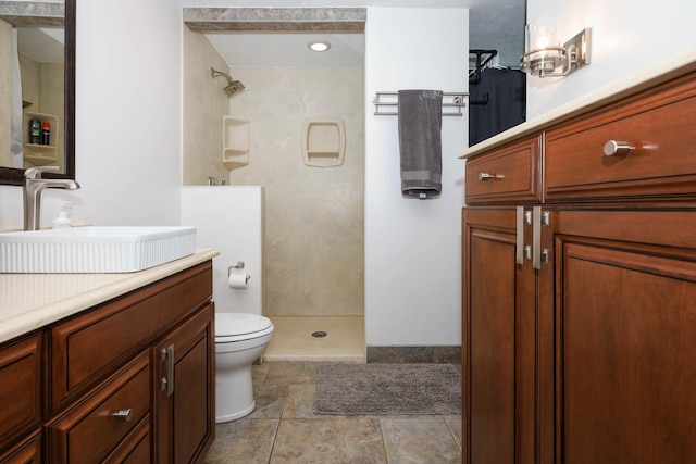554 Fairway Dr, El Paso, IL 61738 - full bathroom featuring toilet, double vanity, a sink, and baseboards