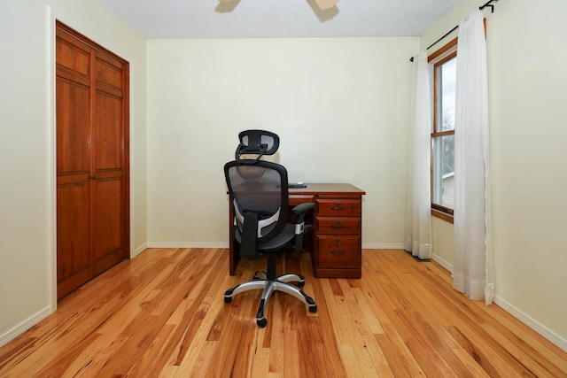 554 Fairway Dr, El Paso, IL 61738 - home office with a wealth of natural light, a ceiling fan, light wood-style flooring, and baseboards