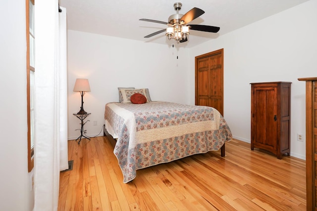 554 Fairway Dr, El Paso, IL 61738 - bedroom with light wood-style flooring, baseboards, and a ceiling fan