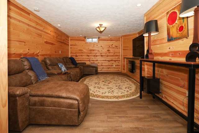 554 Fairway Dr, El Paso, IL 61738 - living room featuring recessed lighting, a textured ceiling, wood walls, and wood finished floors
