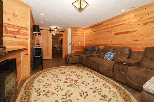 554 Fairway Dr, El Paso, IL 61738 - living area featuring dark wood-type flooring, a textured ceiling, wood walls, and recessed lighting