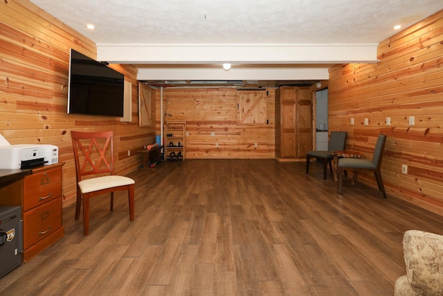 554 Fairway Dr, El Paso, IL 61738 - sitting room with beam ceiling, wooden walls, and dark wood-style floors