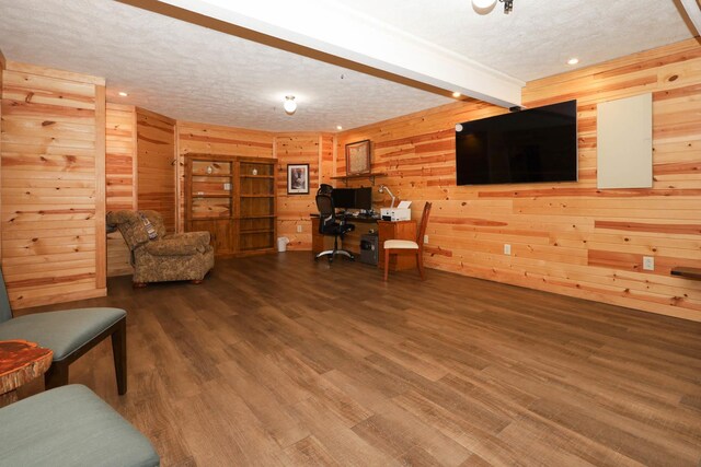 554 Fairway Dr, El Paso, IL 61738 - living area with beamed ceiling, recessed lighting, wooden walls, a textured ceiling, and wood finished floors