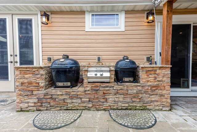 554 Fairway Dr, El Paso, IL 61738 - view of patio / terrace with exterior kitchen, grilling area, and french doors