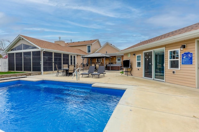 554 Fairway Dr, El Paso, IL 61738 - view of swimming pool featuring a sunroom, a hot tub, a patio area, and a fenced in pool