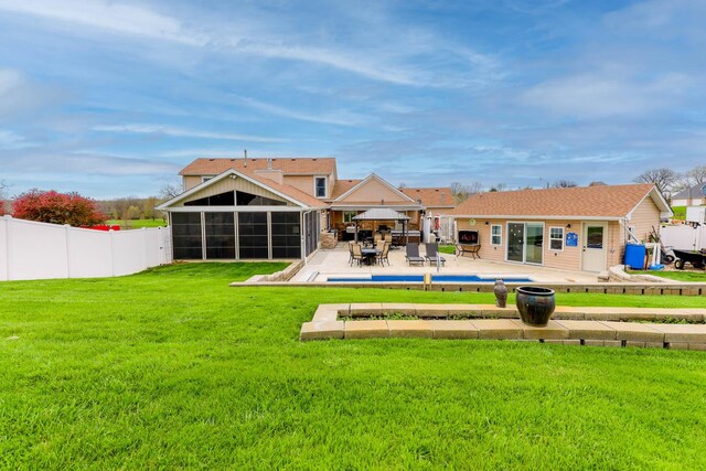 554 Fairway Dr, El Paso, IL 61738 - rear view of property with fence, a lawn, outdoor dining space, a sunroom, and a patio