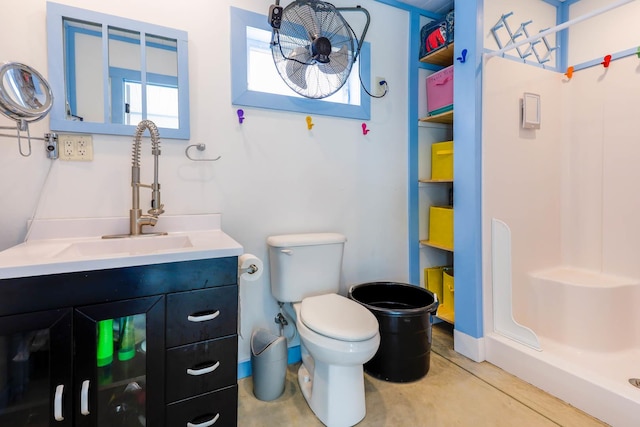 554 Fairway Dr, El Paso, IL 61738 - full bath featuring concrete flooring, toilet, vanity, and a stall shower