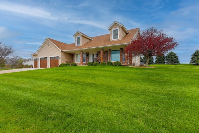 554 Fairway Dr, El Paso, IL 61738 - new england style home with a garage, driveway, a porch, and a front lawn