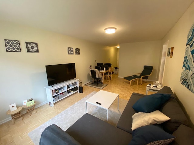 living room featuring baseboards