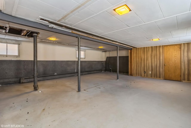 below grade area with a baseboard radiator