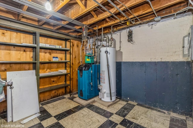 unfinished below grade area featuring electric panel, tile patterned floors, water heater, and a heating unit