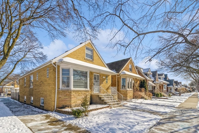 5759 N Moody Ave, Chicago, IL 60646 - view of front facade featuring brick siding, a residential view, and stone siding