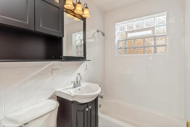 full bath with tub / shower combination, toilet, and vanity