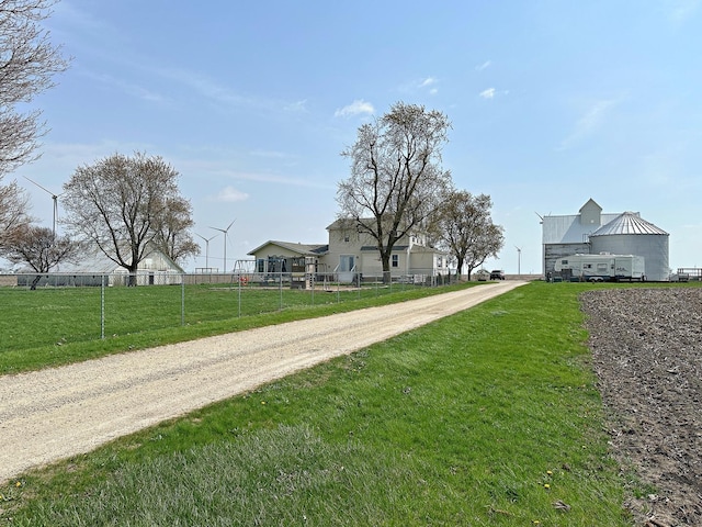 1926 County Road 2800 E, Minonk, IL 61760 - view of front facade with fence, driveway, and a front lawn