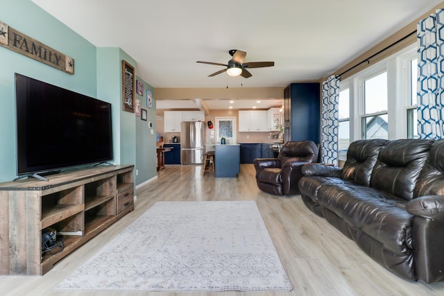 1926 County Road 2800 E, Minonk, IL 61760 - living area featuring plenty of natural light, a ceiling fan, and light wood-style flooring