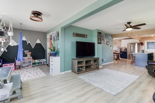 1926 County Road 2800 E, Minonk, IL 61760 - living room featuring light wood finished floors, baseboards, and ceiling fan