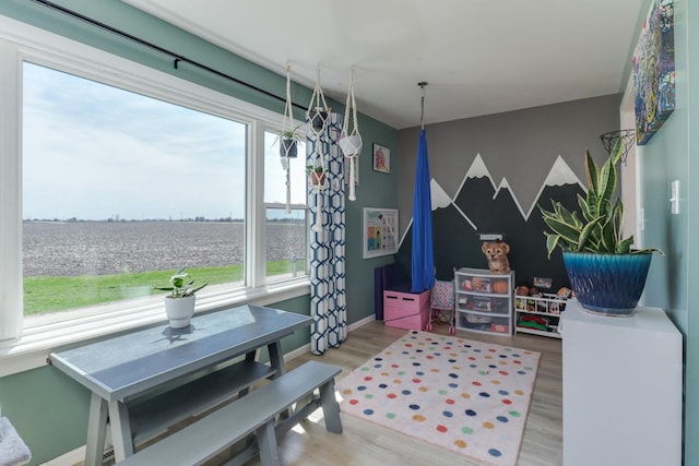 1926 County Road 2800 E, Minonk, IL 61760 - recreation room with wood finished floors, a healthy amount of sunlight, baseboards, and a water view