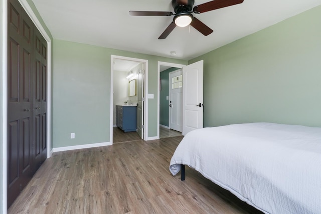 1926 County Road 2800 E, Minonk, IL 61760 - bedroom featuring wood finished floors, a ceiling fan, and baseboards