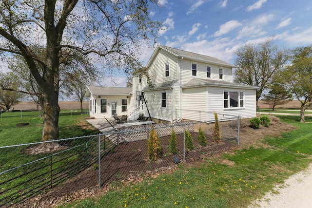 1926 County Road 2800 E, Minonk, IL 61760 - view of front of house featuring a front lawn, entry steps, a fenced backyard, and a patio