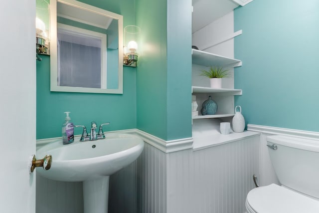 1926 County Road 2800 E, Minonk, IL 61760 - bathroom featuring a wainscoted wall, a sink, and toilet