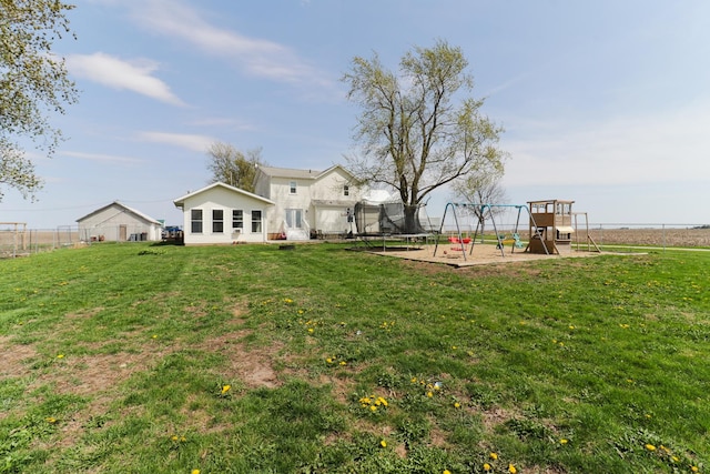 1926 County Road 2800 E, Minonk, IL 61760 - view of yard with fence, a playground, and a trampoline