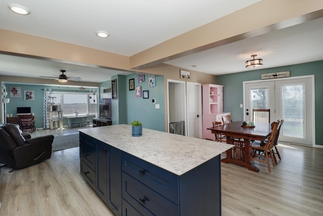 1926 County Road 2800 E, Minonk, IL 61760 - kitchen with light wood finished floors, open floor plan, light countertops, and a center island