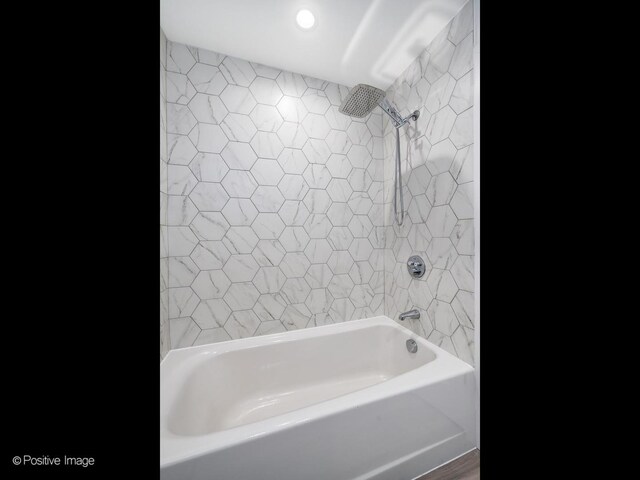 full bath featuring recessed lighting and  shower combination